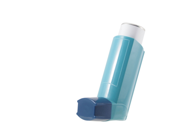 Blue asthma inhaler with blank label isolated on white background. Pharmaceutical product is used to treat or prevent asthma attack. Health and medical concept. - Photo, Image