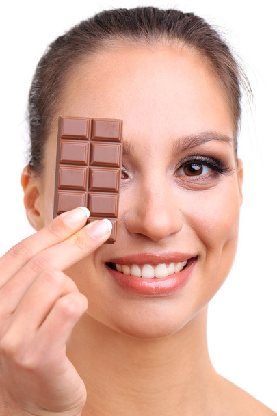 Portrait of beautiful young girl with chocolate isolated on white - Φωτογραφία, εικόνα