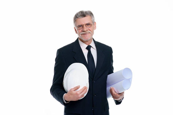 Older business man, civil engineer and designer wear a white safety helmet with project paper isolated on white background. - Foto, Imagen