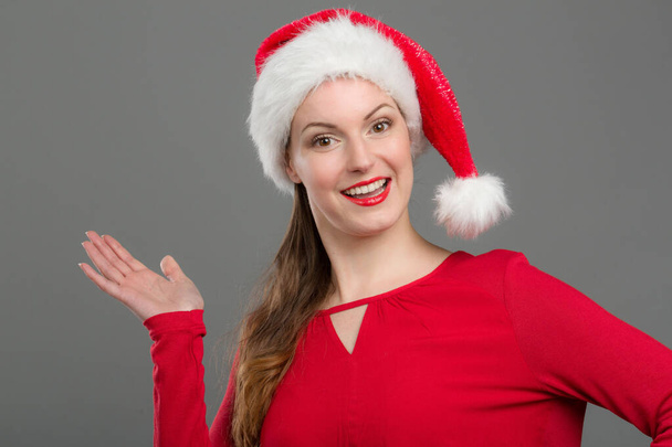 young woman with santa claus hat - Photo, Image