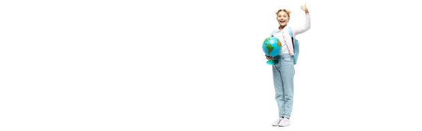 Panoramic shot of schoolkid with backpack and globe showing like on white background - Foto, Imagem