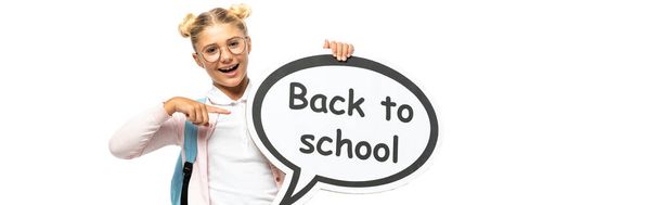 Website header of child pointing at speech bubble with back to school lettering isolated on white  - Photo, image