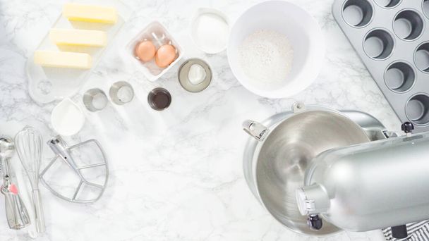 Flat lay. Step by step. Mixing ingredients in kitchen mixer to bake mermaid theme vanilla cupcakes. - Photo, Image