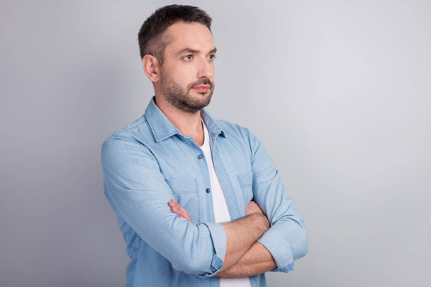 Close-up profile side view portrait of his he nice attractive serious virile content successful masculine guy professional expert folded arms isolated over gray light pastel color background - Fotoğraf, Görsel
