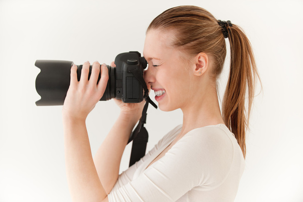 Chica con cámara de espejo
 - Foto, imagen
