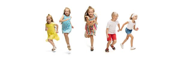 Happy little caucasian kids jumping and running isolated on white background - Photo, image