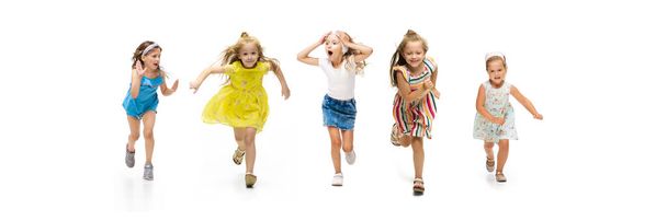 Happy little caucasian kids jumping and running isolated on white background - Photo, Image