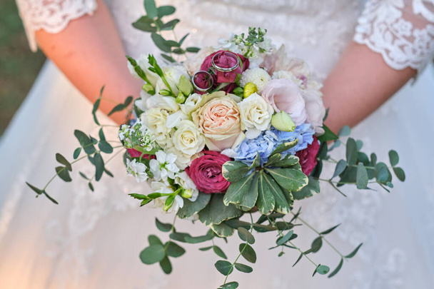 Bride holds a wedding bouquet, wedding dress, wedding details - Photo, Image