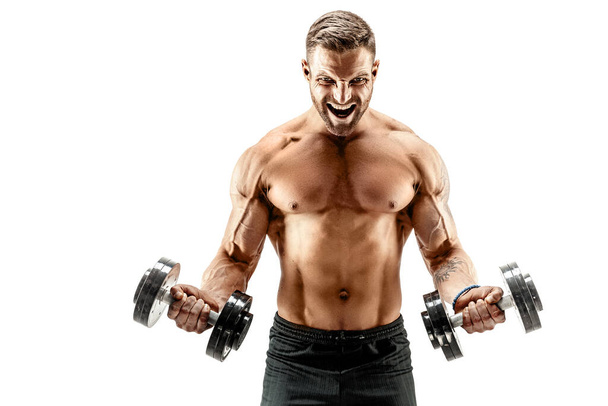Muscular man with dumbbells - Photo, image