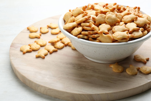 Delicious goldfish crackers in bowl on table - Photo, Image