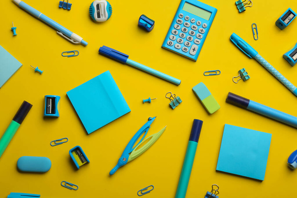 School stationery on yellow background, flat lay. Back to school - Foto, afbeelding