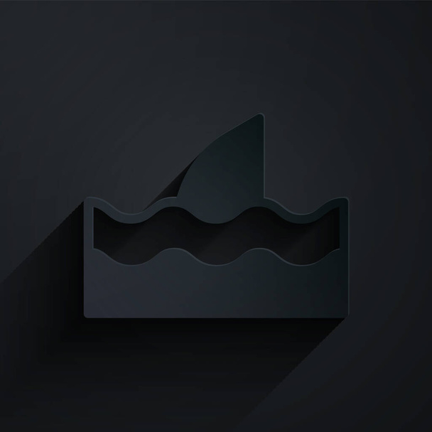 Papiergeschnittene Haifischflosse im Ozeanwellensymbol isoliert auf schwarzem Hintergrund. Papierkunst. Vektor. - Vektor, Bild