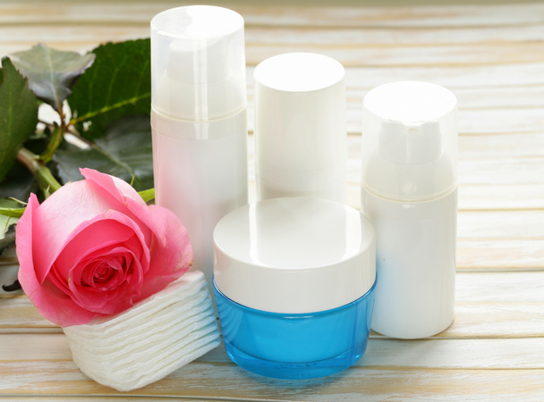 Assortment of jars creams lotion with flowers - organic cosmetics - Fotoğraf, Görsel