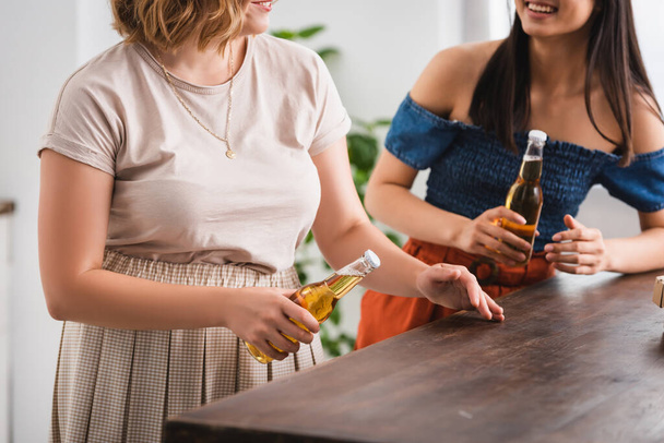 partial view of young women holding beer during party, panoramic concept - Foto, imagen