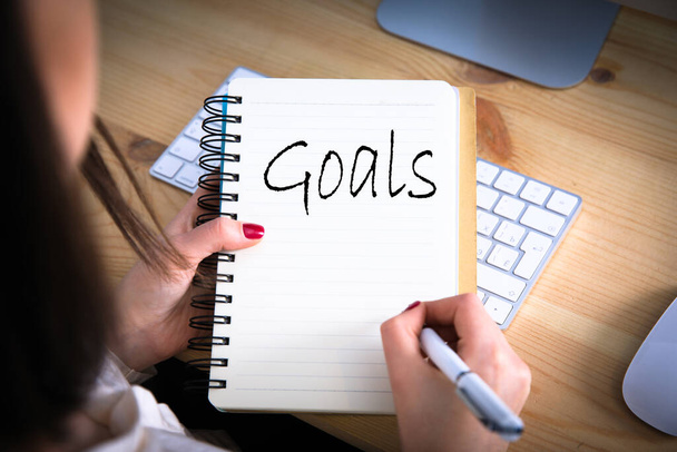 woman written goals text on notepa - Photo, Image
