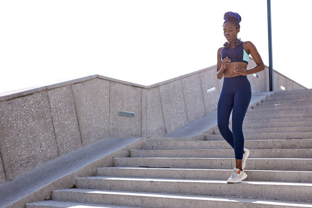 slender fit woman training on stairs outdoors - Foto, imagen
