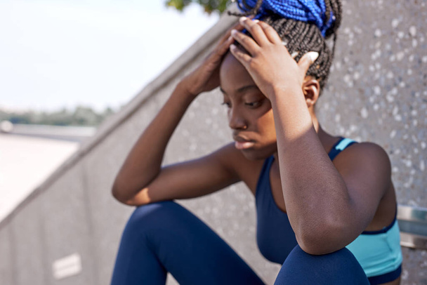 portrait of sweaty black afro woman taking break after sport - Photo, Image