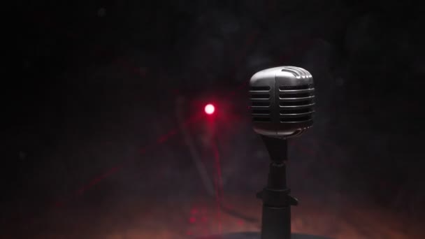 footage of Microphone in dark room on table with back light. Selective focus - Footage, Video