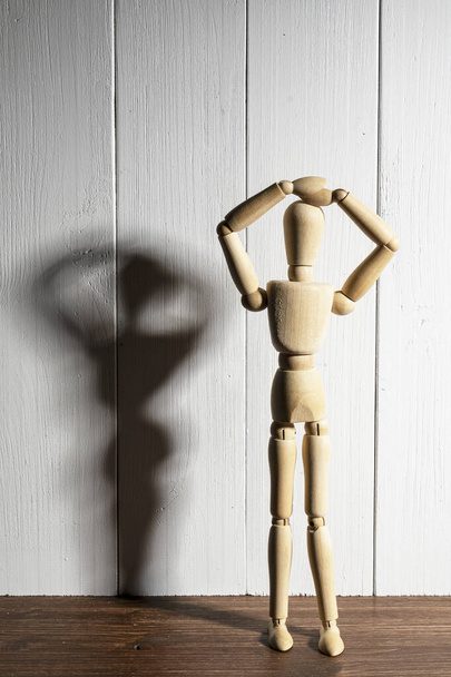 the  wooden mannequin with raised arms - Foto, Imagen