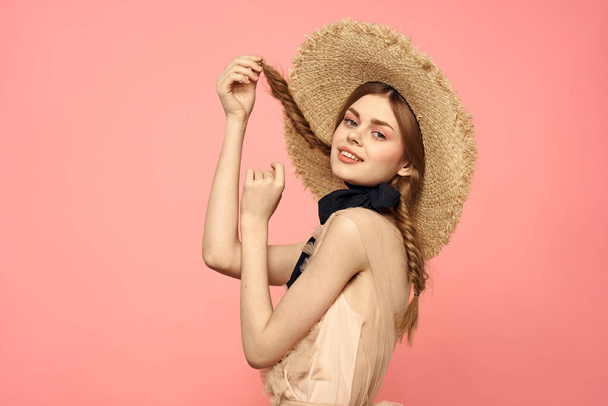 Romantic girl with pigtails and in a straw hat smile romance pink background Copy Space - Fotografie, Obrázek