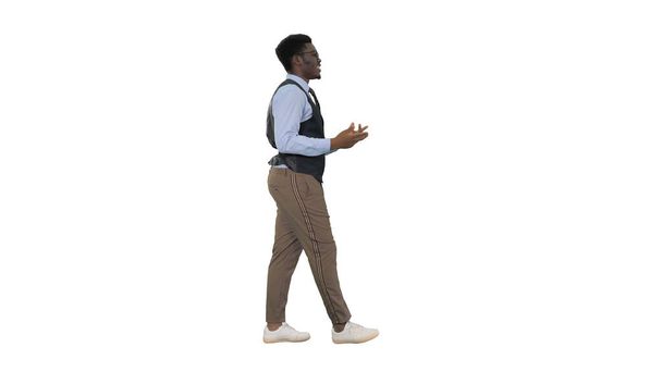 Young African american businessman gesturing and talking to came - Photo, image