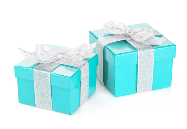 Two blue gift boxes with silver ribbon and bow - Photo, image