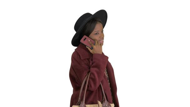 African american fashion girl in coat and black hat talking on t - Foto, imagen