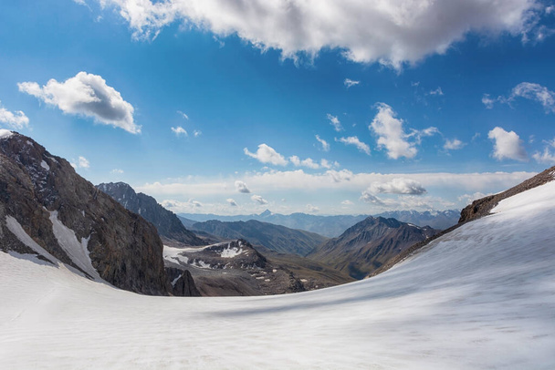 Mountain landscape view in Kyrgyzstan. Rocks, snow and stones in mountain valley view. Mountain panorama. Kyrgyz Alatoo mountains, Tian-Shan, Ala-archa, Kyrgyzstan. - Photo, Image