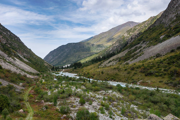 Mountain landscape view in Kyrgyzstan. Green grass in mountain valley view. Mountain panorama. Kyrgyz Alatoo mountains, Tian-Shan, Ala-archa, Kyrgyzstan. - Fotó, kép