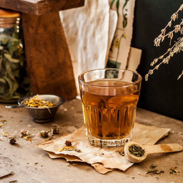 Herbal Tea in a Glass and Variety of Dried Herb Mixes, square - Foto, Imagem
