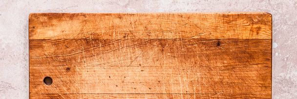 Old Chopping Board on Pink Concrete Background, banner, copy space for your text - Zdjęcie, obraz