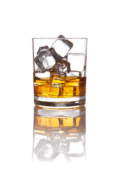 Glass of scotch whiskey and ice on white - Photo, Image