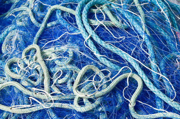 Redes de pesca azul desordenadas
 - Foto, Imagem
