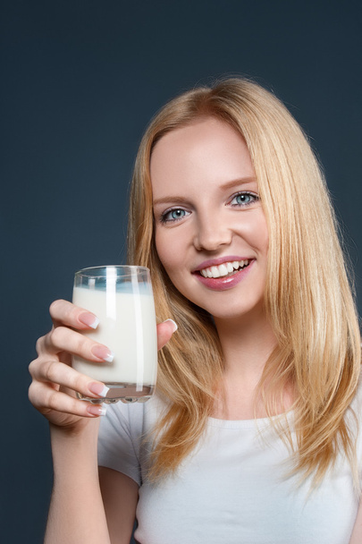 Young woman with milk - Foto, imagen
