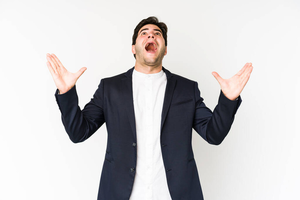 Young business man isolated on white background screaming to the sky, looking up, frustrated. - Photo, Image