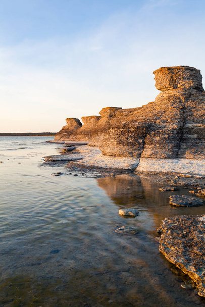 Byrums Limestone formations rock coastline in land in the golden hour - Foto, Bild