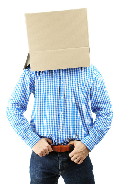 Man with cardboard box on his head isolated on white - Valokuva, kuva