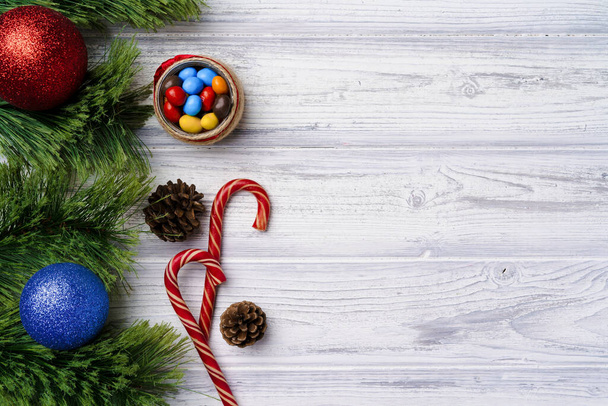 Festive background with candy canes and Christmas baubles - Fotografie, Obrázek