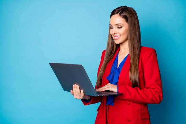 Close-up portrait of her she nice-looking attractive pretty focused cheerful lady agent broker working on laptop creating finance report isolated over bright vivid shine vibrant blue color background - Фото, зображення