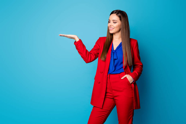 Portrait of her she nice-looking attractive pretty cute fashionable content cheerful cheery lady holding copy space on palm advert isolated over bright vivid shine vibrant blue color background - Foto, Imagen
