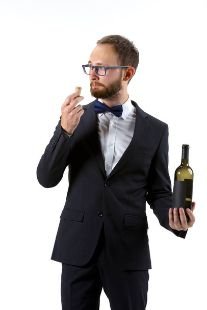 Portrait of male sommelier in suit isolated over white background - Foto, immagini