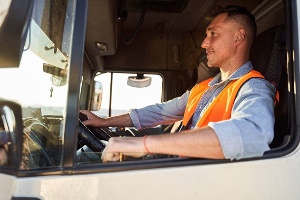 Forwarder or truck driver in drivers cap - Photo, Image