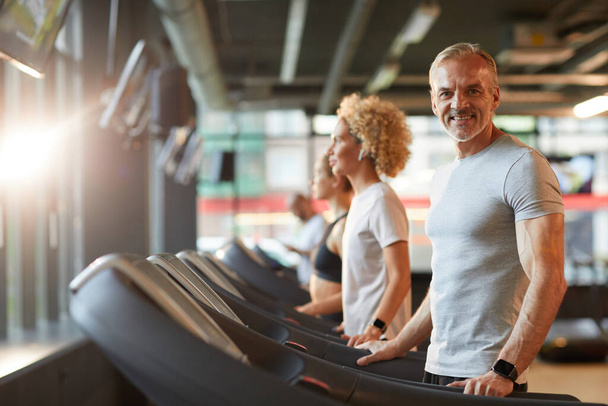 Man training on treadmill - Photo, Image