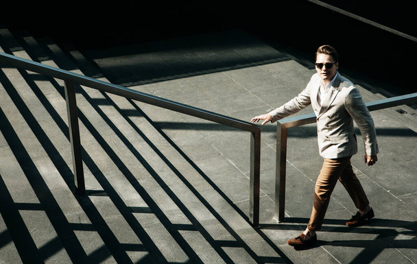 Young Business man going up the stairs - Foto, Imagen