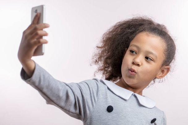 funny African girl is taking a selfie - Valokuva, kuva