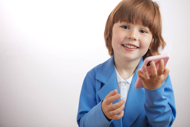 gift for good behavior. boy is beeing presented new modern smart phone Birthday - Фото, зображення