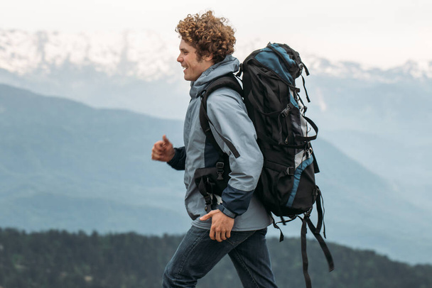young active man is jogging with backpack - Foto, Bild