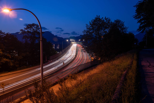 Long exposure picture of light trails on the second narrow bridge.   Vancouver BC Canada - Photo, Image