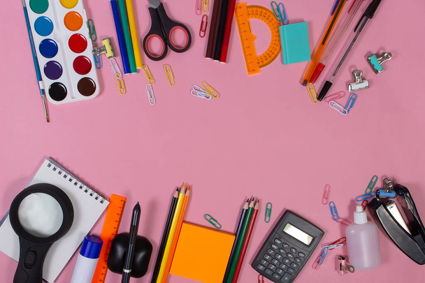 the school supplies on a pink background - Фото, изображение