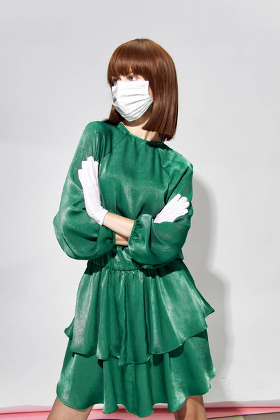  Fashion female coronavirus, model posing with gloves and protective medical mask - Fotó, kép